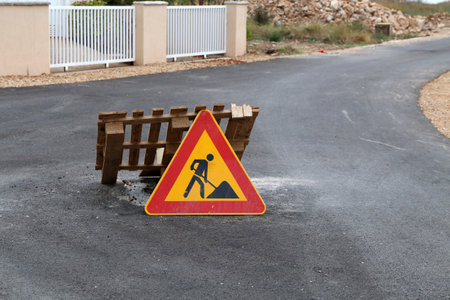 A road sign pending reconstruction of a roadの写真素材