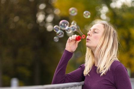 young women blowing some bubblesの写真素材