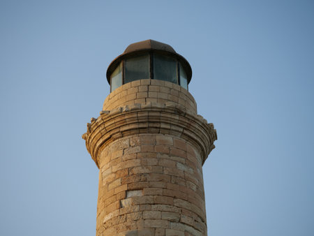 A low angle shot of an old lighthouse at the beachの写真素材