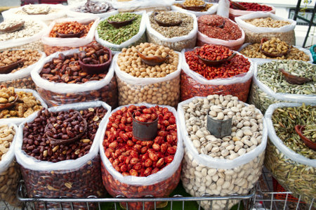A bunch of bags full of different nuts in a local marketの写真素材