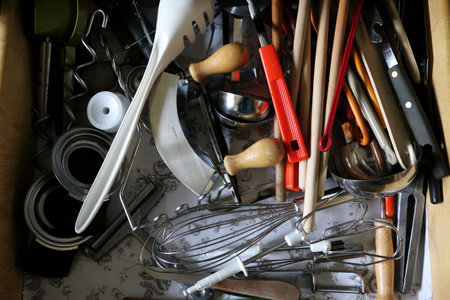 A top view shot of kitchen utensils in the drawerの写真素材