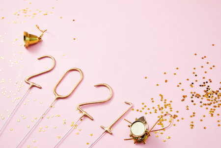 Happy New Year 2021 Golden numbers 2021 with shiny golden stars on a pink backgroundの写真素材
