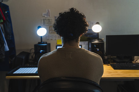 A musician working at his home studioの写真素材