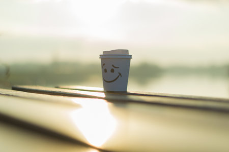A closeup shot of a coffee cup on the benchの写真素材