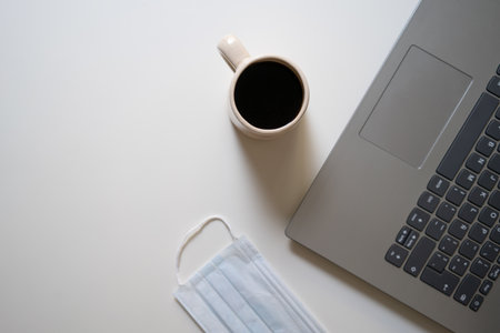 Topview of coffe, computer and maskの写真素材