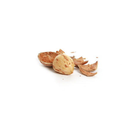 A broken almond isolated on a white background