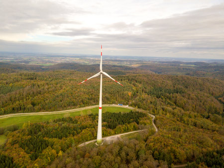 A shot of a wind turbine in a rainforestの写真素材