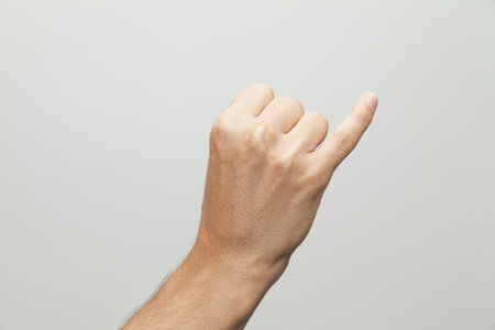 A closeup shot of a hand gesture on white backgroundの写真素材
