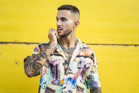 A closeup shot of a young European male with tattoosの写真素材