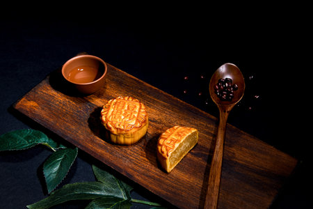 A high angle shot of mooncakes on a wooden surface