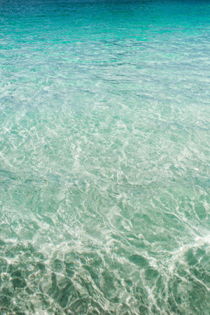 A vertical shot of crystal clear water surface as a background - copy spaceの写真素材
