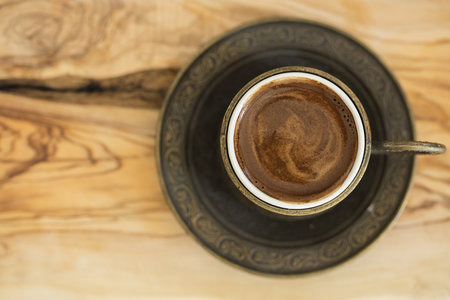 A closeup of Turkish coffee served in a traditional cupの写真素材