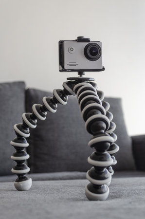 A closeup shot of sports camera with gorilla tripodの写真素材
