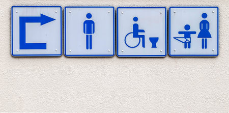 A closeup shot of the public sign for restroomsの写真素材