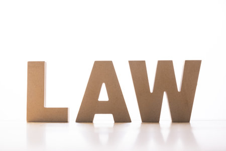 A closeup shot of the word "Law" from wooden lettersの写真素材