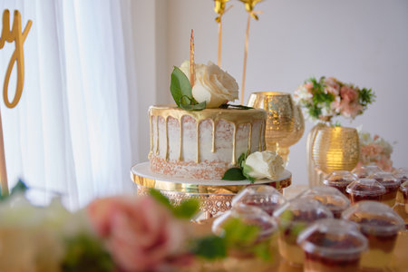 A birthday party table decorated with cake and sweetsの写真素材