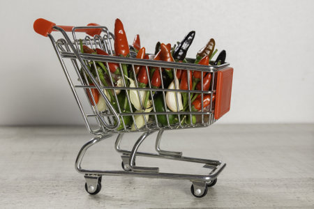 A closeup shot of a shopping cart full of small peppersの写真素材