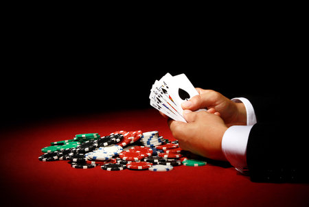 A closeup shot of a person playing poker