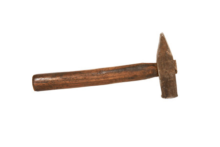 A rusty old wooden hammer isolated on a white background