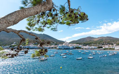 A beautiful beach with boats and buildings captured during the daytimeの写真素材