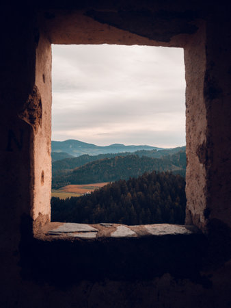 A view through a window on the mountainsの写真素材