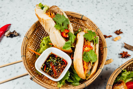 A closeup shot of delicious Vietnamese food including Pho ga, noodles, spring rolls on white...