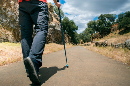 detail of the feet of a man hiking in the forestの写真素材