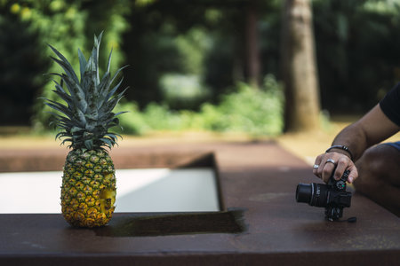 A man shooting a Halloween pineapple