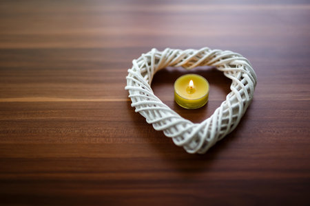 A closeup shot of a candle with a heart for Valentine's Dayの写真素材