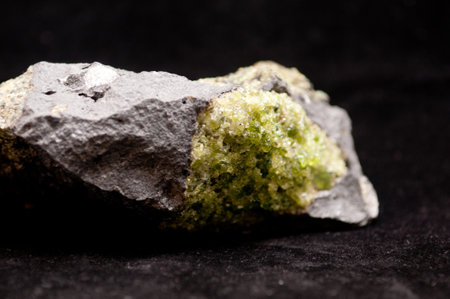 olivine mineral sample with peridot and graniteの写真素材