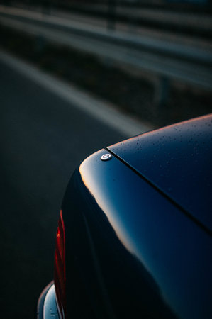 Details of a car with the sunset sky reflecting in it.の写真素材