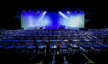An empty conference center with a lot of empty chairsの写真素材