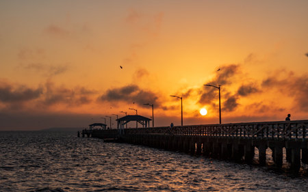 A beautiful shot of a bright sunrise near a port in Tampa Bay, Floridaの写真素材