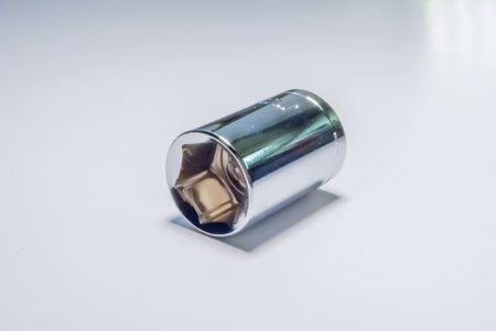 A closeup of  metal ratchet socket on white background  metal ratchet socket on white background