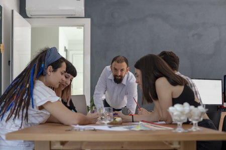 A closeup shot of a team working on a project in a conference room