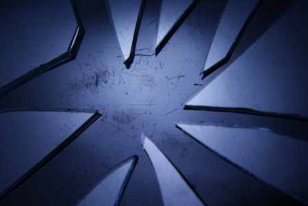 A closeup of sharp blades on a metallic surface under the lights - concept of violenceの写真素材