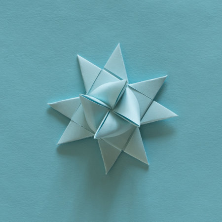 A top view of a blue origami 3D star on craft paper on the tableの写真素材