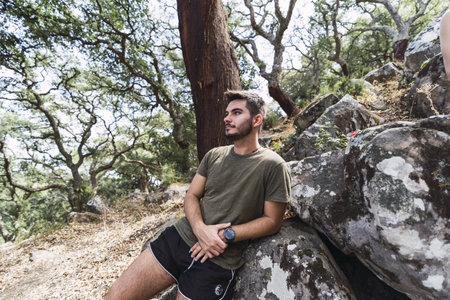 A closeup shot of young male hiking in the hills