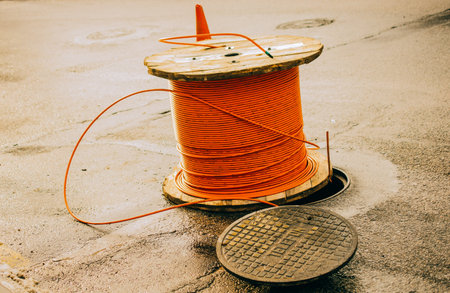 A closeup of orange fiber optic cableの写真素材