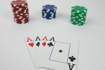 the playing ace cards and red blue green isolated poker chip stacks
