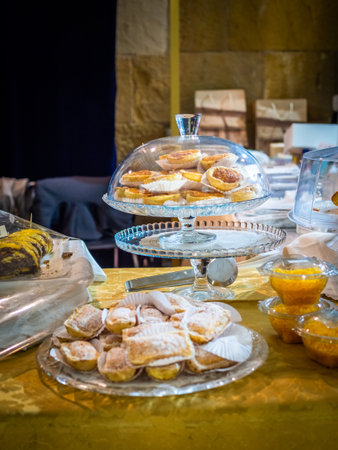 A vertical shot of traditional Portuguese conventual sweets on tableの写真素材