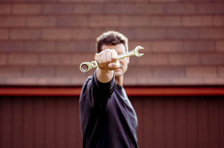 A closeup shot of a technician holding a toolの写真素材