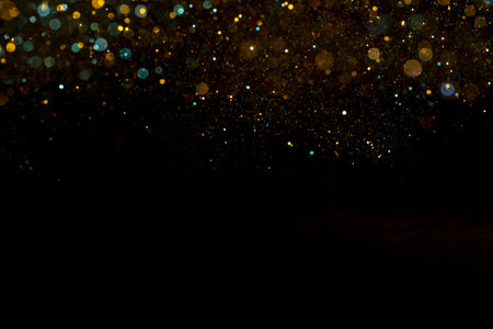 The shiny colorful bokeh lights on a black background
