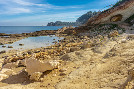 A closeup shot of the Javea Xabia Cala Blanca beach in Alicante in Spainの写真素材