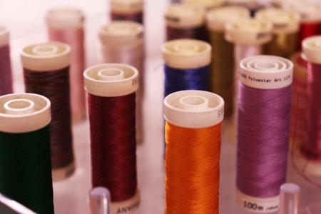 A closeup shot of colorful sewing threads