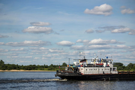 A motorship sailing on the sea at daytimeの写真素材