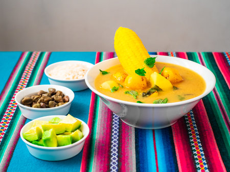 Bowl of Vegan Ajiaco, Traditional Pre Colombian South American Dish Composed of Three Diferent Types of Potatoes, Sweet Yellow Corn and Guascaの写真素材