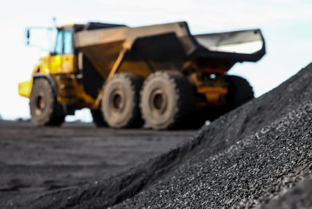 A pile of sand near a truck on a manganese mining site in South Africa