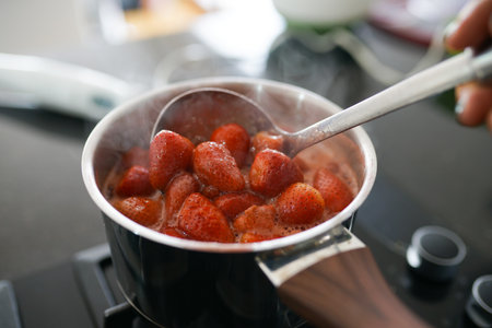 A selective focus shot of boiling strawberriesの写真素材