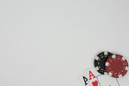 a white background and the poker chips and playing cards on the corner